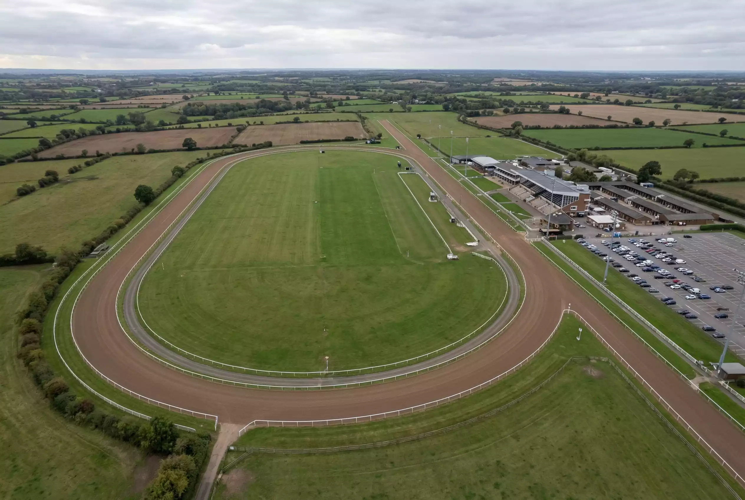 Aerial view of Chelmsford City left-handed Polytrack oval showing the sprint chute and home straight